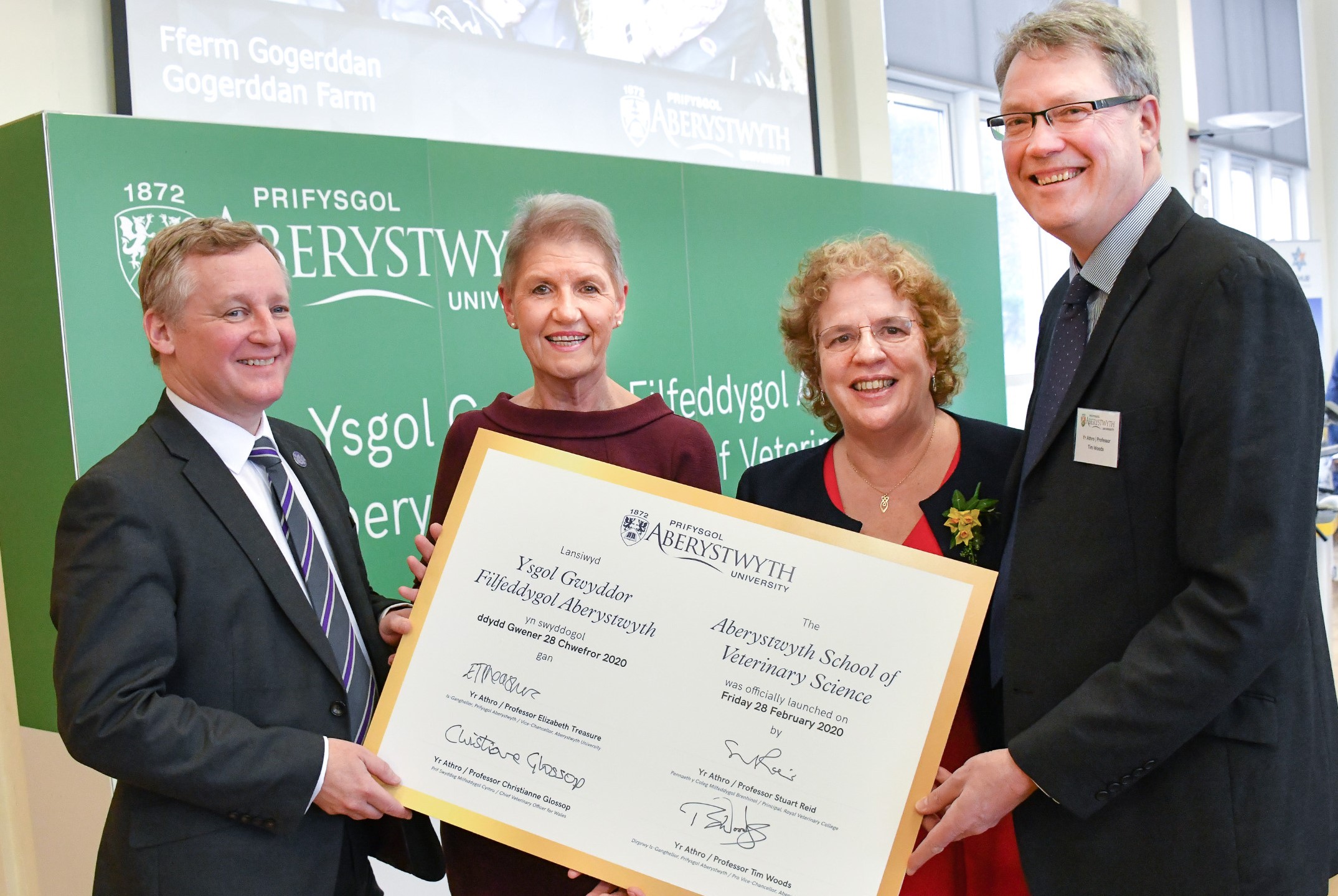 Left to right: Professor Stuart Reid, Principal of the Royal Veterinary College; Professor Christianne Glossop, Chief Veterinary Officer for Wales; Professor Elizabeth Treasure, Vice- Chancellor and Professor Tim Woods,  Pro Vice-Chancellor at Aberystwyth University marking the launch of the Aberystwyth School of Veterinary Science.