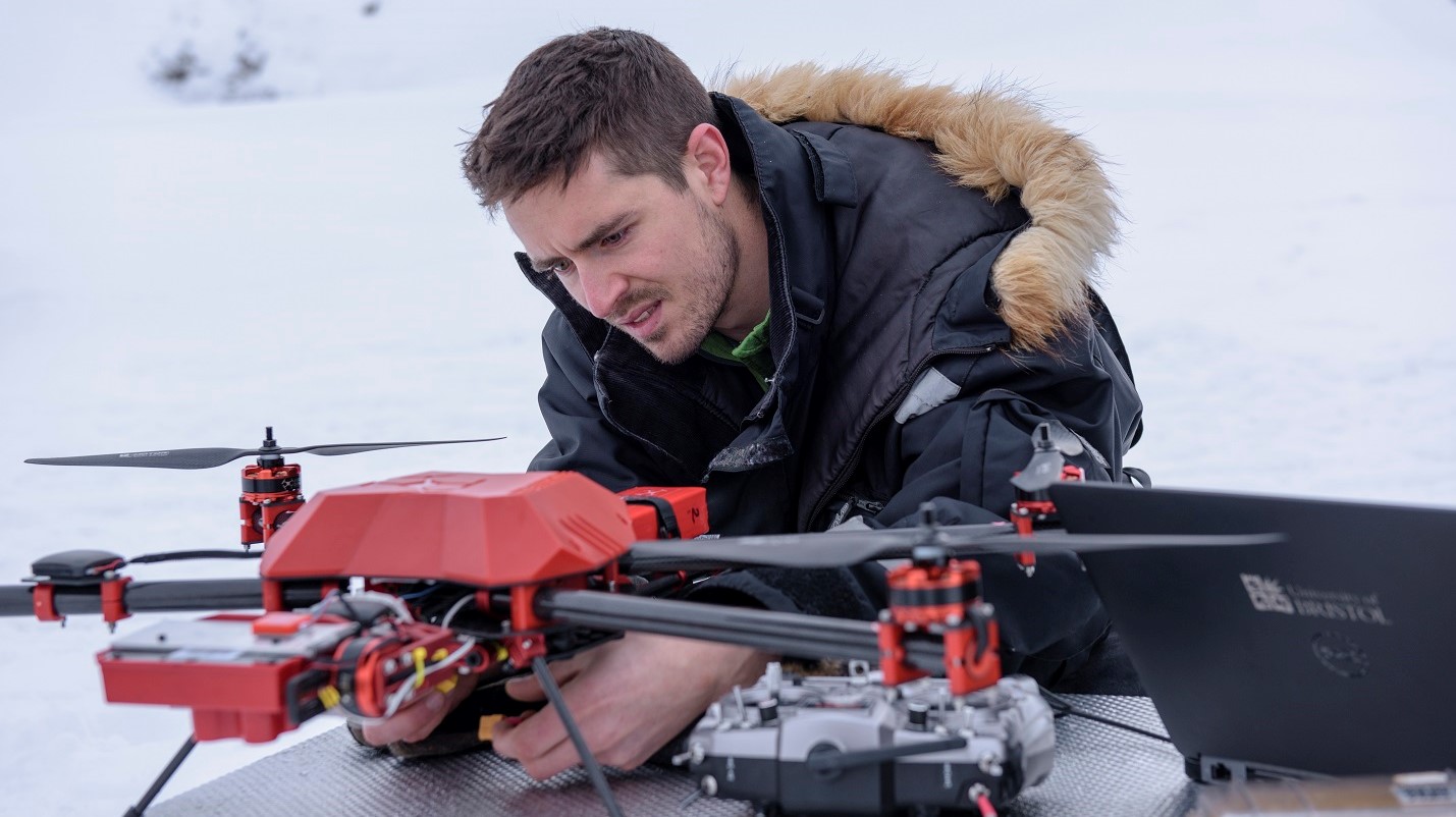 Dr Joseph Cook adjusting the quadcopter in the field in Svalbard (credit Marc Latzel /Rolex)