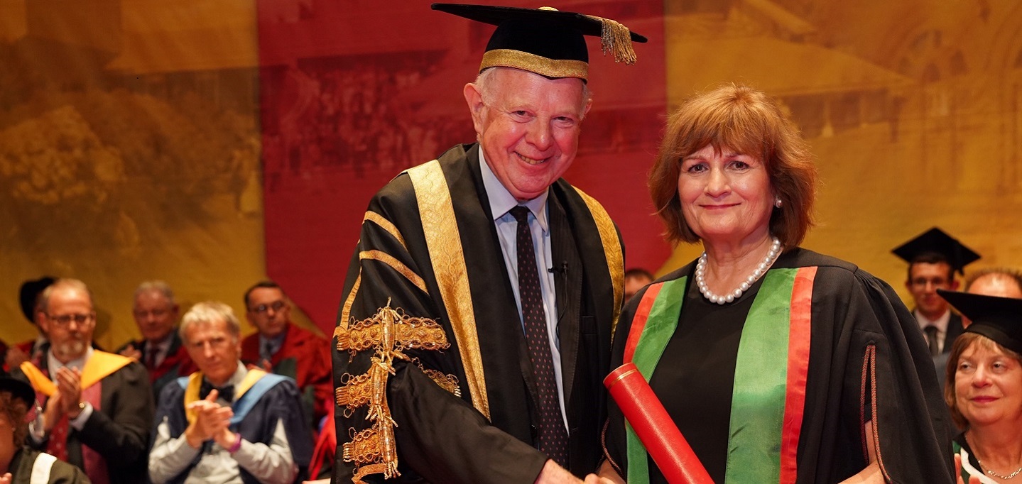Aberystwyth University Chancellor Lord Thomas of Cwmgïedd presenting Judith Diment, Coordinator of the Rotary International Polio Eradication Advocacy Task Force, as an Honorary Fellow of the University during the 2019 graduation ceremonies.
