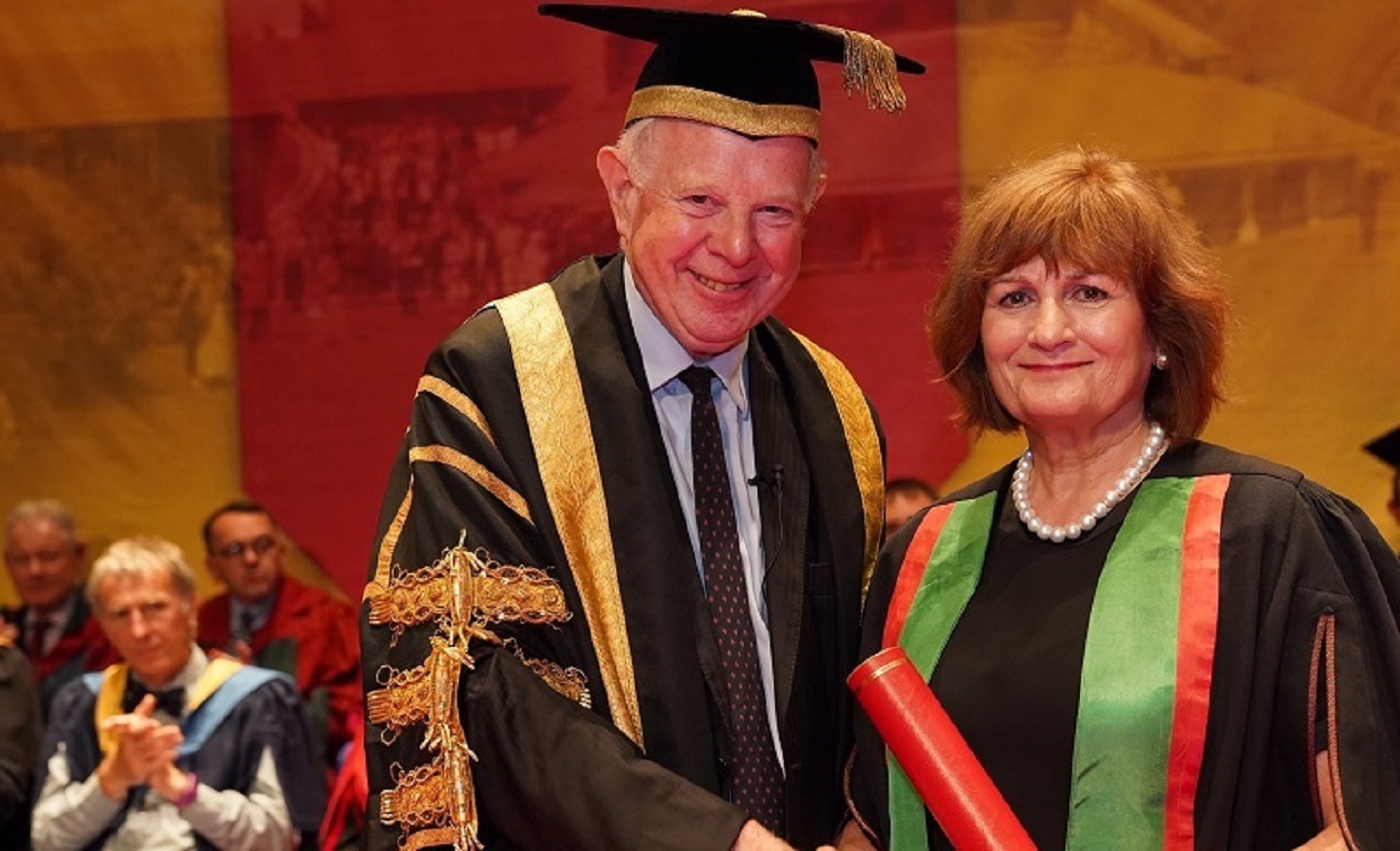 Aberystwyth alumna and leading figure in the international campaign to eradicate polio, Judith Diment, being presented as Fellow of Aberystwyth University by University Chancellor Lord Thomas of Cwmgiedd during Graduation 2019