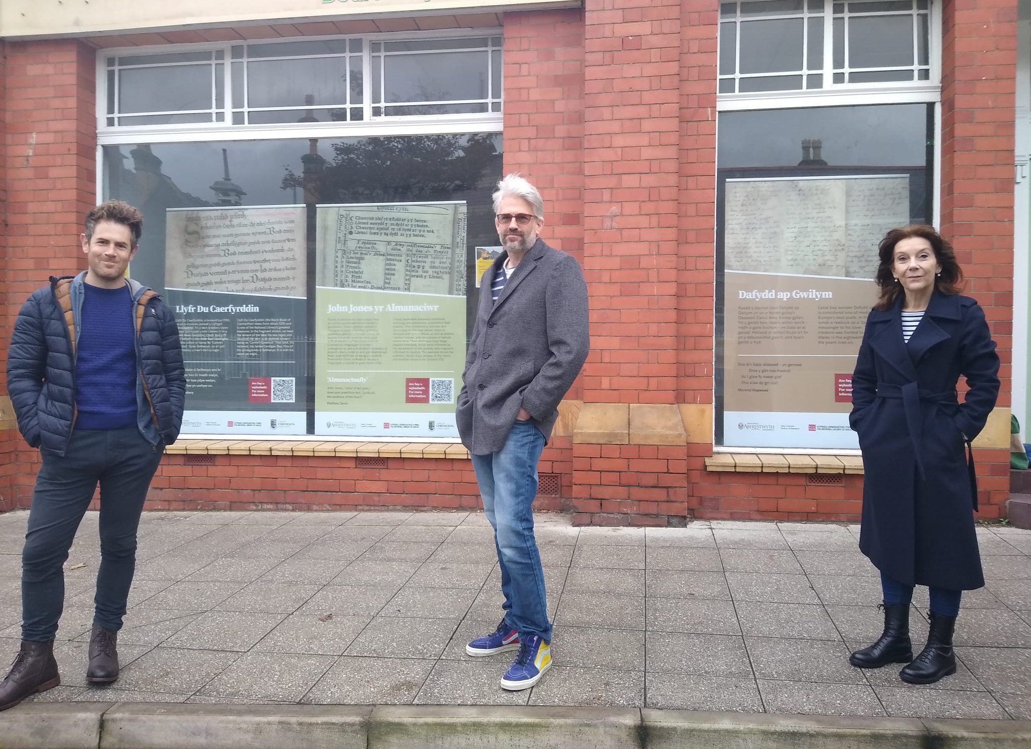 From left to right: Aberystwyth University academics Eurig Salisbury, Professor Matthew Jarvis and Professor Mererid Hopwood outside the old gasworks in the town.