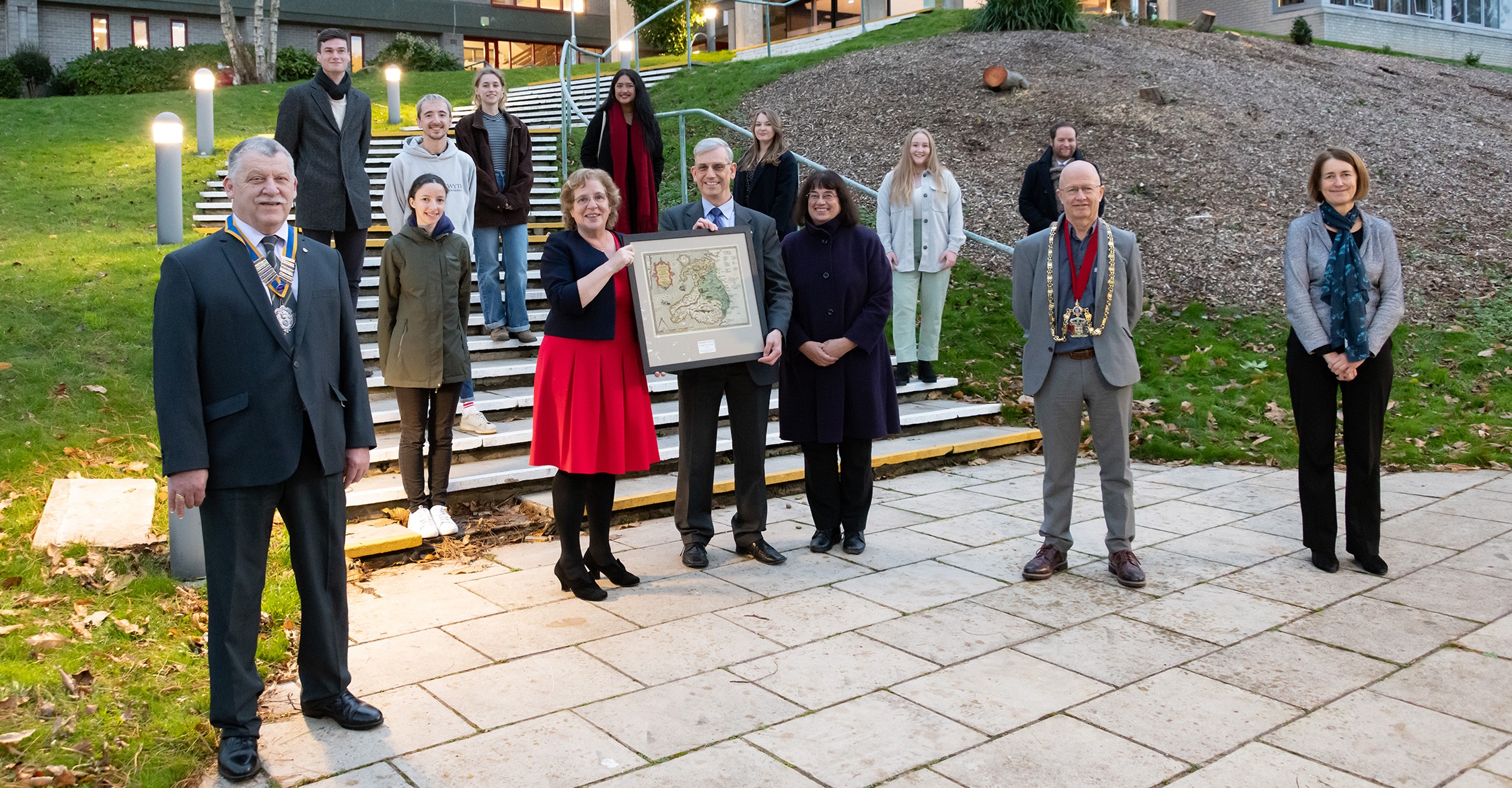 Aberystwyth University Vice-Chancellor Professor Elizabeth Treasure presents a copy of Humphrey Llwyd's Cambriae Typus, printed in 1573 in Antwerp by Abraham Ortelius, to Mr William Parker and Vivien Hopkirk to mark the launch of the European Opportunities Fund, which has been funded by a generous donation by Mr Parker.