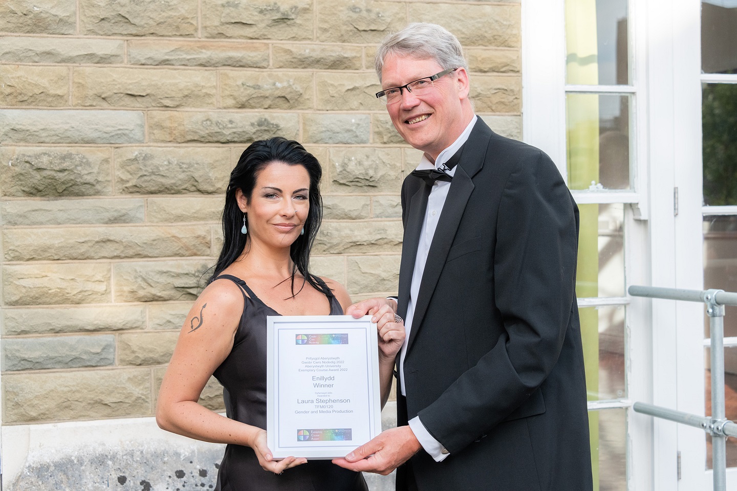 Professor Tim Woods, Pro Vice-Chancellor, Learning, Teaching and Student Experience, presents Dr Laura Stephenson, Department of Theatre, Film and Television Studies, with her Exemplary Course Award 2021/22.