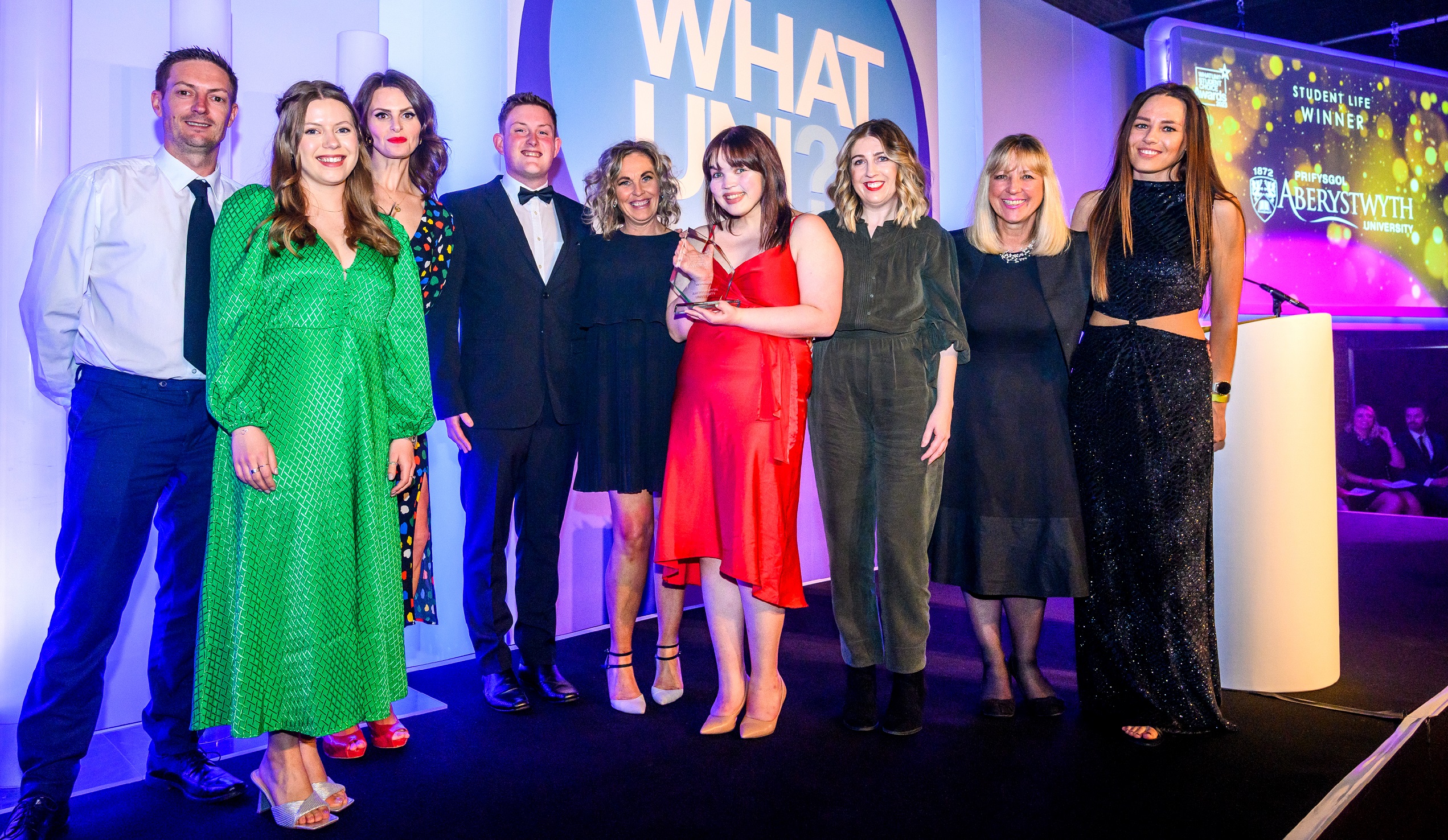 Aberystwyth University staff members receive the Student Life Award at the 2023 Whatuni Student Choice Awards.