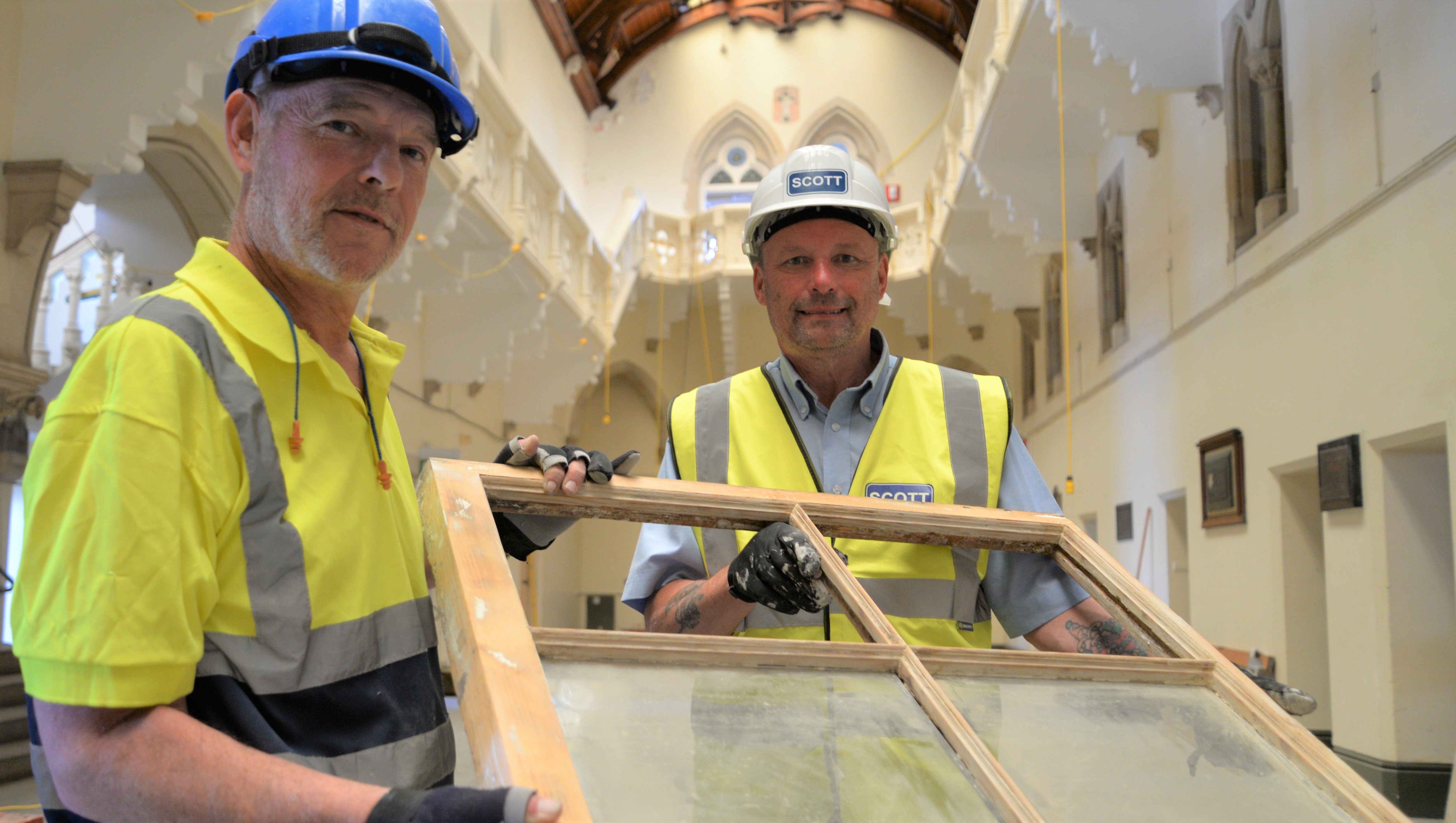 Cardigan based heritage carpenter Gary Davies (left) and Leighton Brown, Project Manager with Andrew Scott Ltd with one of the original windows from the Georgian Villas. The Old College features 664 windows, set in stone, steel and wooden frames.