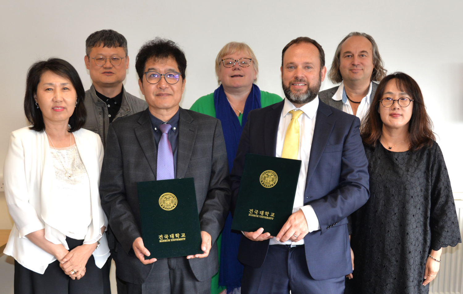 Professor Inseop Shin and Professor Peter Merriman with the signed Memorandum of Understanding between Aberystwyth University and Konkuk University