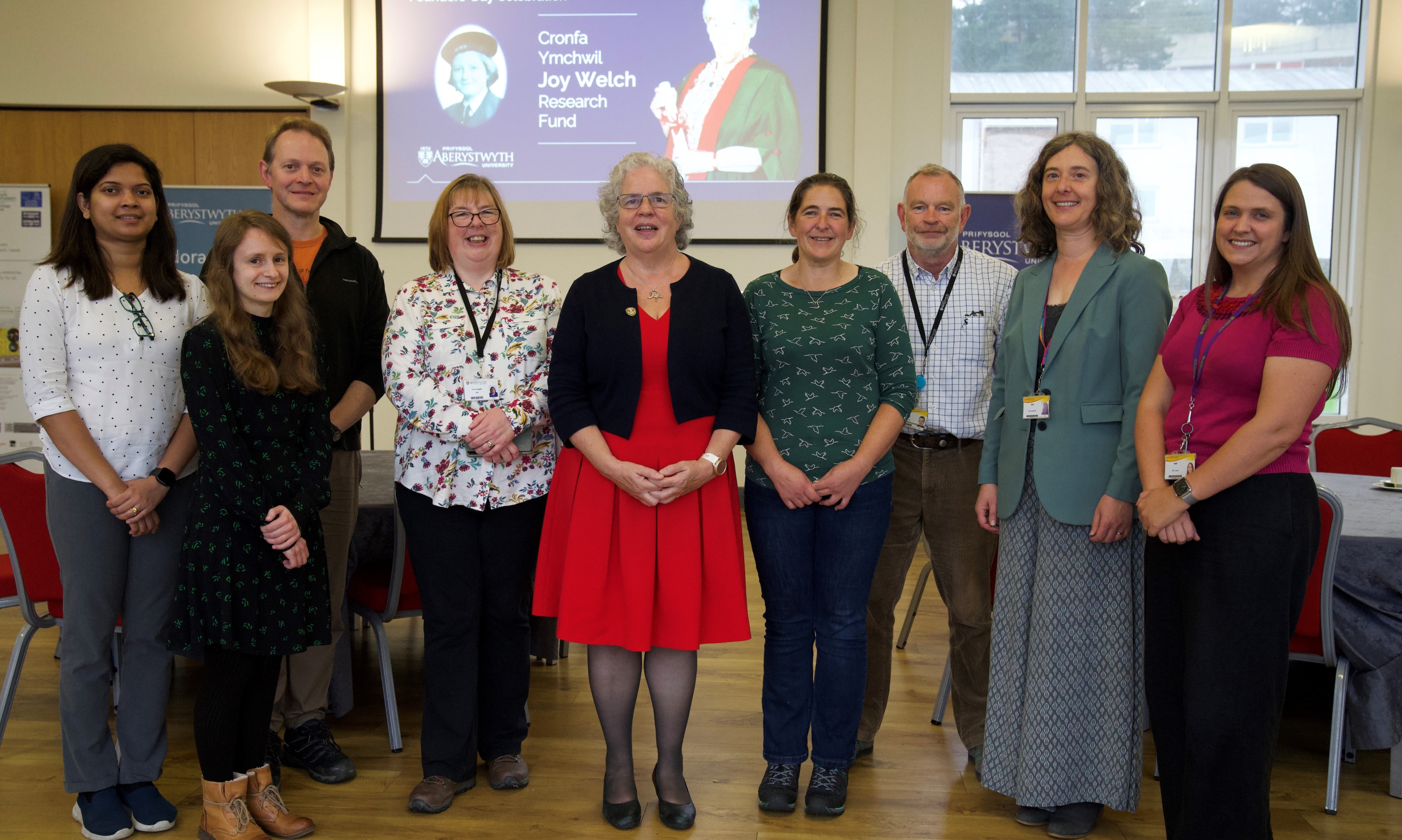 Vice-Chancellor Professor Elizabeth Treasure (centre) and Dr Eva De Visscher, Trusts and Foundations Manager at Aberystwyth University (second right) mark the new Joy Welch endowment with researchers who have received support from the Trust (left to right) Dr Valerie Rodrigues (Life Sciences), Dr Alice Vernon (English and Creative Writing), Professor Stephen Tooth (Geography and Earth Sciences), Tracy Knight, Dr Sarah Dalesman and Dr Rhys Thatcher (Life Sciences), and Dr Rachel Cross (Physics).