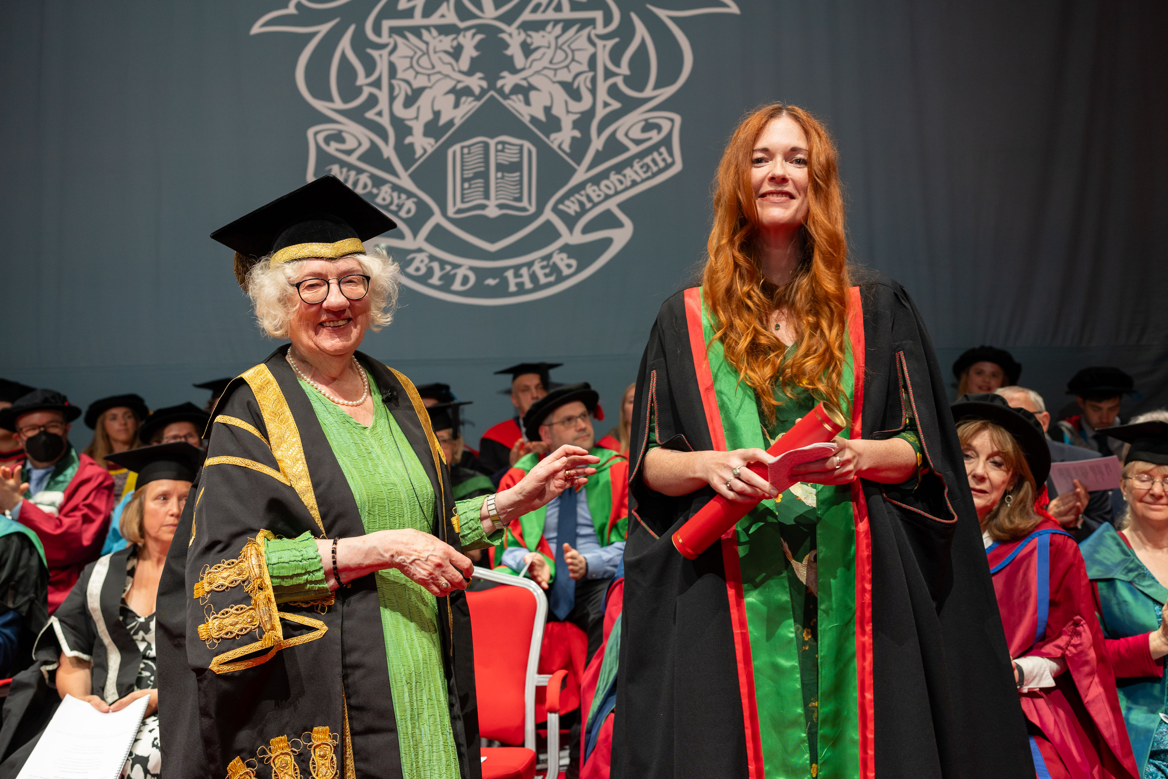 Professor Dame Elan Closs Stephens DBE, Deputy Chancellor of Aberystwyth University, presenting Manon Steffan Ros as an Honorary Fellow