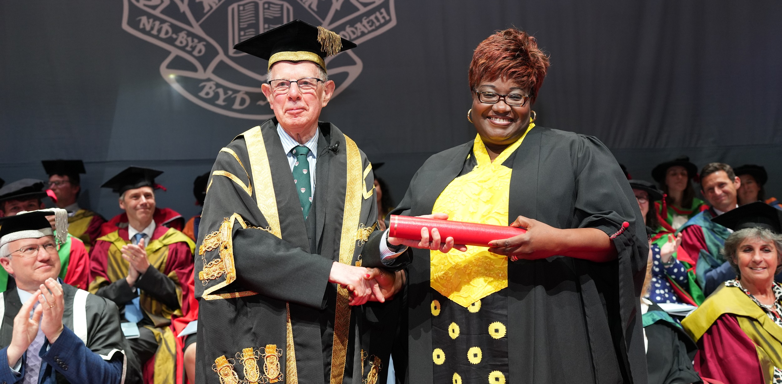 Rt Hon Lord Thomas of Cwmgïedd, Chancellor of Aberystwyth University, presenting Professor Uzo Iwobi as Honorary Fellow