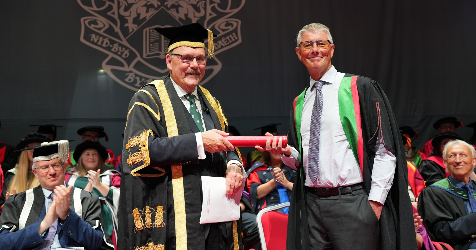 The Rt Hon. Elfyn Llwyd, Pro-Chancellor of Aberystwyth University, presenting Professor Sir Stewart Cole as Honorary Fellow