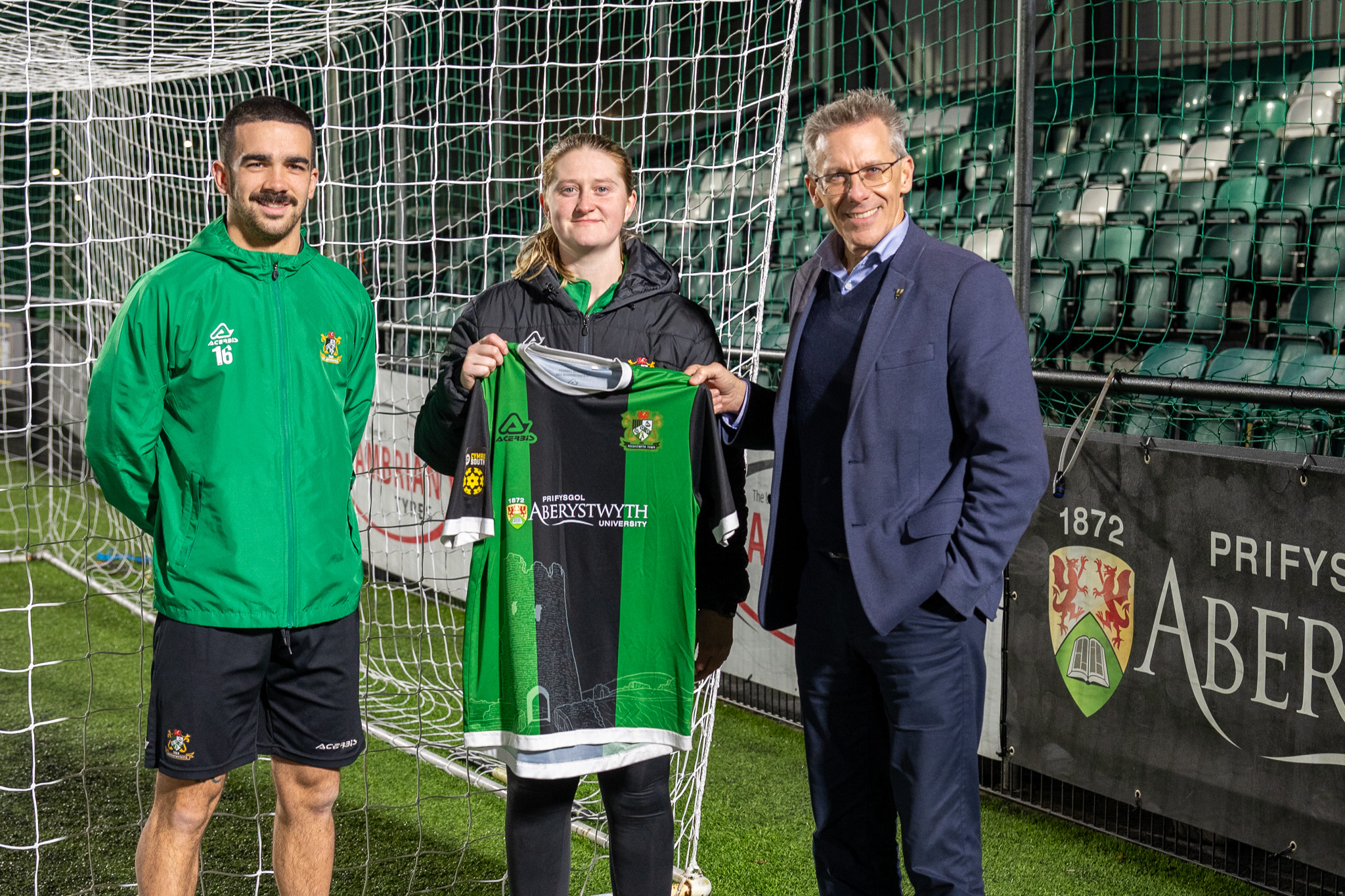 Aberystwyth Town Football Club’s Women and Men’s Captains with Aberystwyth University Pro-Vice Chancellor Professor Iain Barber and the new kit