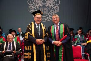Rt Hon Elfyn Llwyd, Pro-Chancellor of Aberystwyth University, presenting Rob McCallum with his Honorary Doctorate degree