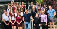 Group photo of the young poets on steps outside the Aberystwyth Arts Centre.