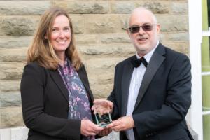 Dr Christine Marley from the Institute of Biological, Environment and Rural Sciences, and one of last night's winners, being presented with her award by Professor Colin McInnes, Pro Vice Chancellor for Research, Knowledge Exchange and Innovation.