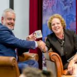 Carwyn Jones shaking hands with Elizabeth Treasure