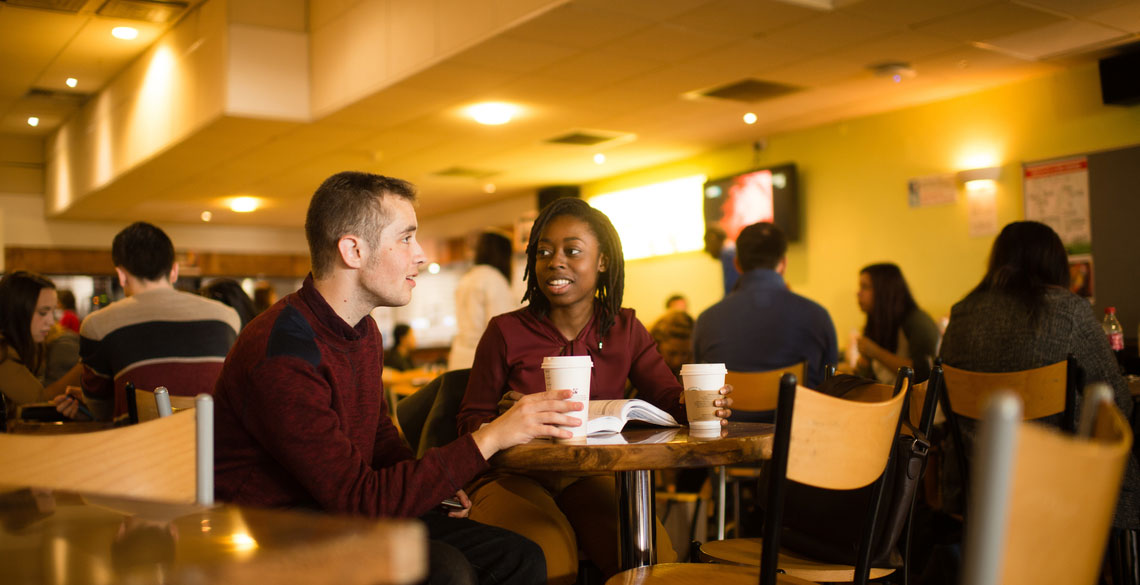Students chatting in a cafe