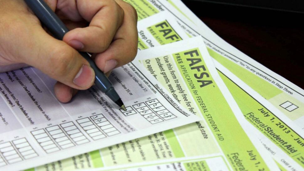 A person filling out their FAFSA document