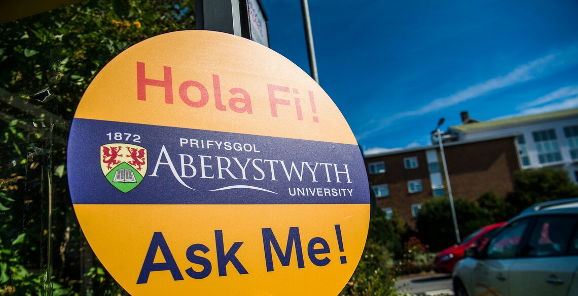 University branded sign with the words 