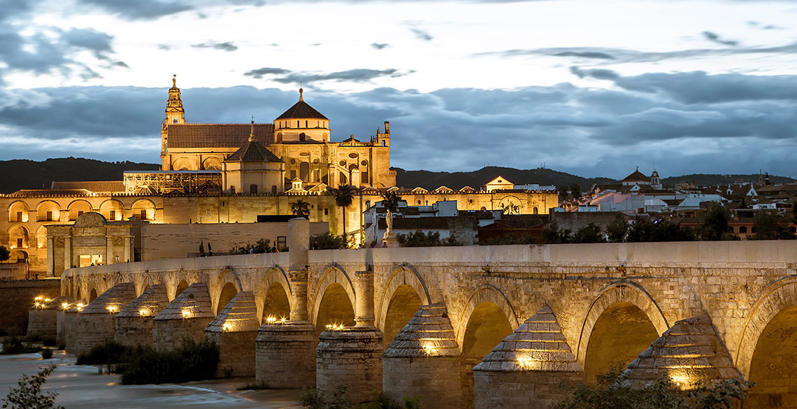 Cordoba at sunset - bridge and buildings 